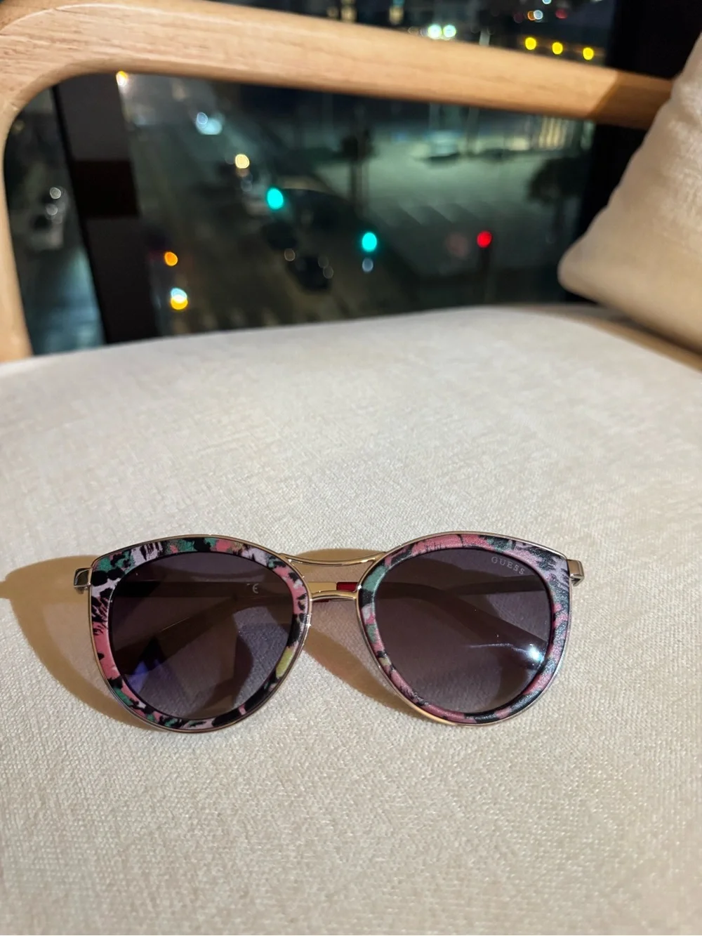 GUESS Pink Floral Cat-Eye Sunglasses with a silver bridge